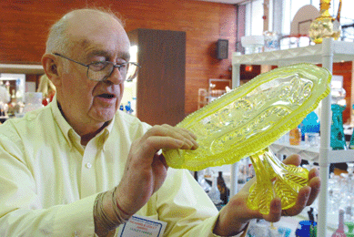 Richard Harris shows off a rare canary compote. "If perfect, it would be in the $18/20,000 range,†the Branchville, N.J., dealer said. 