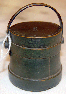 The miniature Windsor green painted firkin brought a record $8,892. It was signed "CH,†a possible identification of Caleb Hersey, who was a toymaker in South Hingham, Mass., in the mid- to late Nineteenth Century.