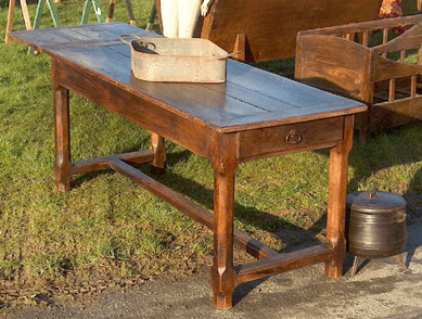 The table had one company end extension, was from Ireland and was priced at $1,200.