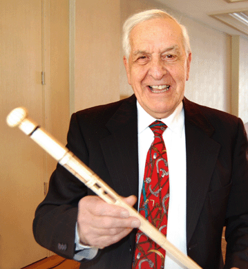 Wearing his lucky cane tie, Henry A. Taron presided over his 32nd live cane auction.
