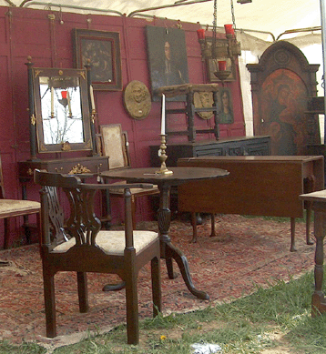 Chelsea Hill Antiques, Hampton, Conn., was offering elegant hardwood furniture, including this gentleman's smoking chair.