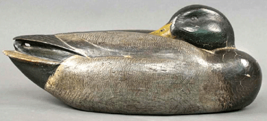 A sleeping mallard by Enoch Reindahl sold over estimate for $92,000, a new record for a Wisconsin decoy and exactly twice what it sold for at the McCleery sale in 2000.