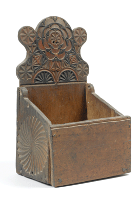 The elaborately carved wall box, circa 1720, is fashioned of pine with milk paint. Museums of Old York.