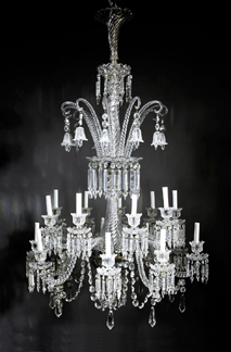 Against five competing telephones, the pair of late Nineteenth Century elaborately cut crystal 18-light chandeliers, one shown, probably by Baccarat sold at a solid $56,400 to a collector in the room.