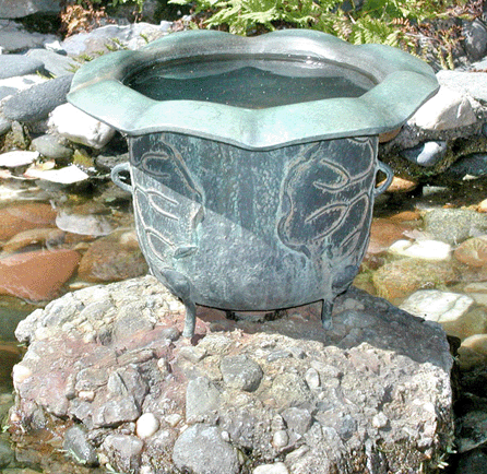 The 1908 Art Nouveau bronze fountain measures 15 inches high and 10 inches across.