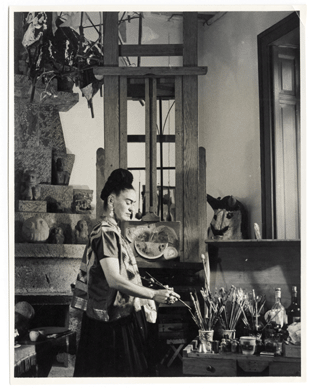 This photo by an unknown photographer shows Kahlo in her studio in the Casa Azul (Blue House), her beloved family home on the outskirts of Mexico City, where she lived most of her life. Visitors today to the Museo Frida Kahlo will find the studio virtually intact. Vicente Wolf photography collection.