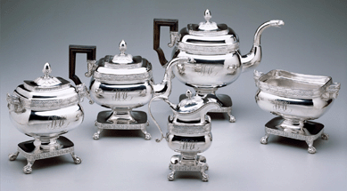 Five-piece tea and coffee service, Philadelphia, made by Thomas Fletcher and Sidney Gardiner, silver and wood, 1812‱820. Collection of the Newark Museum, purchase 1968, Sophronia Anderson Bequest Fund.