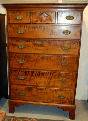The Eighteenth Century Chippendale tiger maple chest realized $10,350.