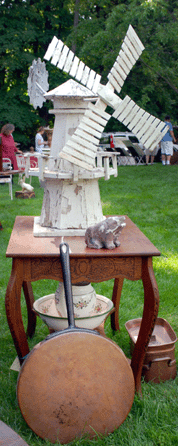 An early weathervane in the form of a windmill was catching the breeze off the pond at Appleton Manor Gallery, New Ipswich, N.H.