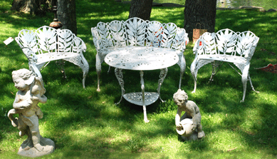 Set amid idyllic trees and pond, this iron garden set by Molla, from the turn of the Twentieth Century, is the same pattern as a set on the White House lawn, according to Pat Torraco from Selective Iron, Norwalk, Conn.