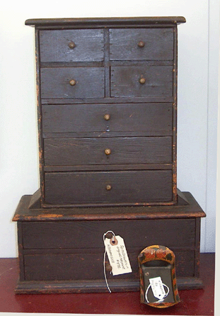 Nan Gurley and Peter Mavris always exhibit at their shows, here showing two miniature pieces. The chest is less than 2 feet tall, and the tole ware bread tray about 6 inches long.