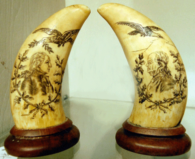 A pair of whale teeth, one of which was decorated with a wreathed image of George Washington and the other with a wreathed Benjamin Franklin, fetched $2,588.