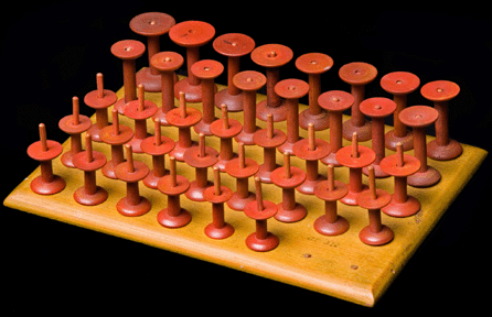 A pine spool rack was a practical way to organize thread. The spools are dowelled into the rack, which is inscribed in pencil on the bottom, "Levi Stevens made this.†Brother Levi lived at Canterbury until his death in 1867.