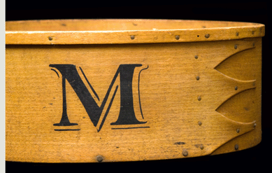 The stenciled mark on the painted spit box indicates use in the Ministry (M) or the meeting room (M.R.). 
