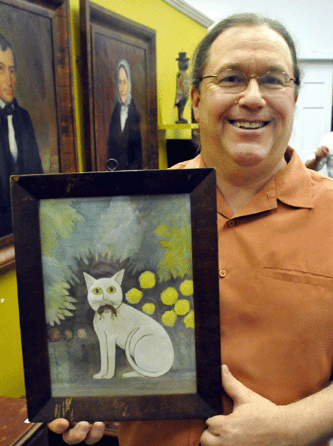 "I guess you have figured out what my favorite piece in the auction is,†commented auctioneer Jim Cyr of the 12-by-9-inch watercolor of a cat with a mouse in its mouth. The cat, whose bright yellow eyes expressed satisfaction with its kill, also seemed pleased with its selling price of $19,550. 