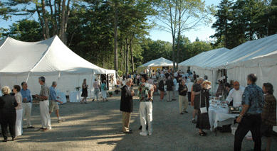Food tables lined the outside of the tents and drew crowds at the preview.