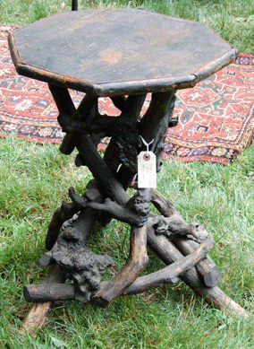 Wickford (R.I.) Antiques showed a burl root stand from about 1900.