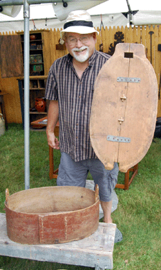 Michael Miller of Miller Robinson Antiques, Ashfield, Mass., is pictured with a Norwegian storage box.