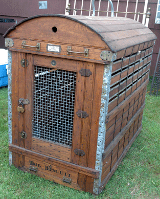It takes a big †and important †dog to travel in this turn-of-the-century oak dog cage. The tag above the door reads, "Valuable Dog. Please Feed & Water.†Fred's New England Antiques, North Kingston, R.I. ⁎ew England Motel