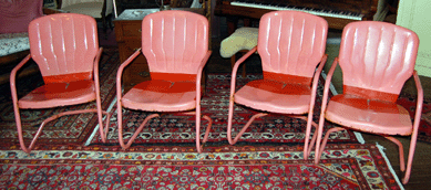 Jazzy, almost tropical, the set of eight flamingo pink painted metal garden chairs attracted $224.