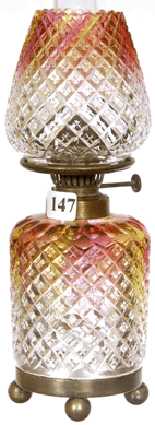 The miniature 9-inch cut glass rainbow-colored oil lamp with tulip-shaped shade brought $9,130.