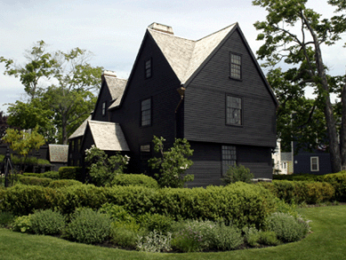 From a simple house of two rooms downstairs and two upstairs, the 1668 House of the Seven Gables expanded to a grand 17-room house of more than 8,000 square feet. Four original windows of an original room are visible in the side wall. The massive original chimney contains a hidden staircase.