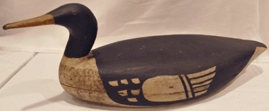 "An outstanding example of American folk art by one of Maine's premier decoy carvers,†was the description assigned to the Oscar Bibber merganser. In wonderful old dry paint, it sold for $39,100.