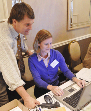 Steve and Cinnie O'Brien go over some last-minute bids prior to the auction.