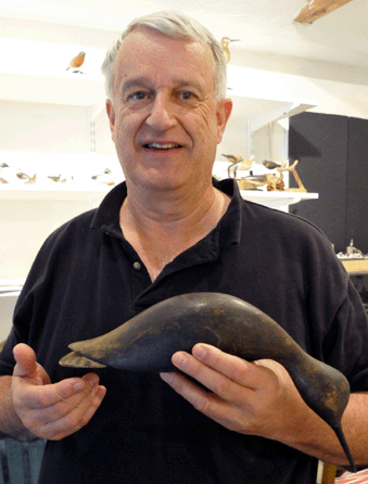 Decoys Unlimited principal Ted Harmon with the oversized feeding willet, attributed to John Wilson of Ipswich, Mass., circa 1880s. It sold for $230,000.