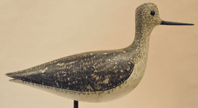 The rare "Talbot Family†gunning rig, consisting of 11 yellowlegs shorebirds, one shown, by New Hampshire carver George Boyd was discovered in a basket next to the furnace in a seasonal Massachusetts home located near the ocean. Said to be excellent examples of Boyd's earliest style with exaggerated necks and flat top heads, they sold at $149,500.