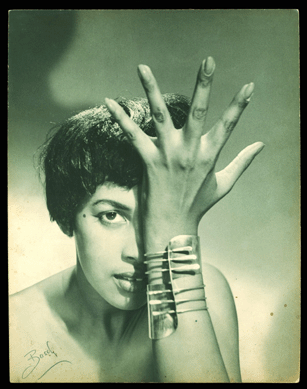 The circa 1948 "Modern Cuff†bracelet alludes to Smith's fondness for jazz. The model is wearing the bracelet in a photograph that appears to have been made by Peter Basch.