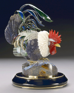 This carved opal rooster by Manfred Wild, Idar-Oberstein, Germany, sold for $72,000 to a Russian private collector. The realistic carving rendered in black and white precious Australian opal features a brilliant red cock's comb carved of carnelian and a beak of yellow agate. The tail feathers are enhanced with colored enamel on gold and accented with 74 diamonds, with a total weight of 1.25 carats. His 18K yellow gold feet stand firmly planted upon a base of boulder opal atop a circular black onyx base decorated with gold borders. 