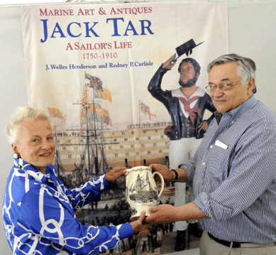 Hannah Henderson and Ron Bourgeault prior to the start of the J. Welles Henderson marine collection auction on Saturday.