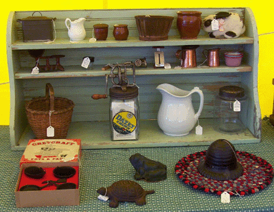 Sun High Antiques, Bloomsburg, Penn., had a stand filled with miniatures; the copper wash boiler on the top shelf is only about 4 inches tall.