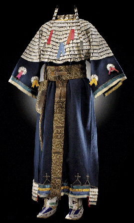 A Sioux dress with a dentalium shell yoke was made about 1900 in South Dakota of "saved list†(cloth with the selvedge incorporated in the dress) indigo wool cloth. The extensions along the hem, which refer to the legs of the animal, are also decorated with dentalium shells. The tubular dentalium shells were a prized commodity, used as currency among some tribes; in others, three shells were the equivalent of one buffalo robe.