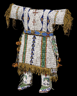 A Sicangu Lakota (Sioux) girl's dress from about 1890 is fully beaded with green and blue geometric designs on a seed beaded white ground. Matching moccasins and leggings, and the degree of care with which all were made, attests to the love for the girl who wore the dress.