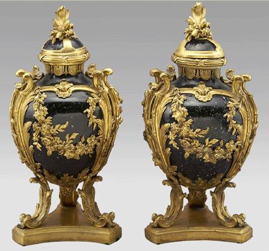 A pair of Louis XVI-style gilt bronze mounted cassolettes brought $17,925.