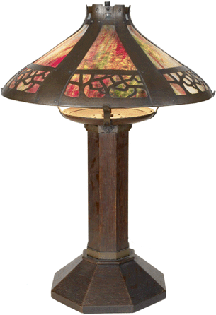 The #625 oak lamp, circa 1909, with its copper and glass shade shows the variety in Stickley's later designs. 