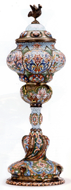 The Russian silver and shaded enamel covered chalice measuring 15 inches tall, bearing the marks of Ivan Khlebnikov, estimated at $12/18,000, soared to $265,000.