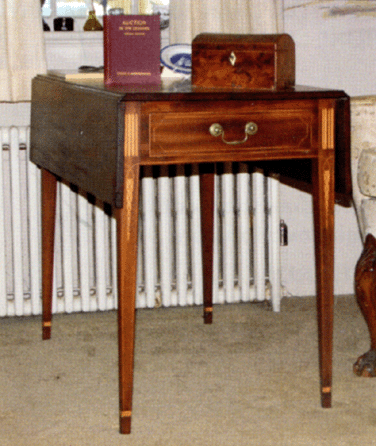 This Federal Pembroke drop-leaf table in mahogany, with bookend and icicle inlays, sold for $8,800.