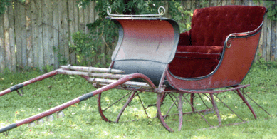 Dating from the Nineteenth Century, a horse-drawn cutter sleigh in red paint with bells and harness, E.A. Stratton, Jaffrey, N.H., that sold for $990.