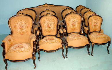 This circa 1860 11-piece Louis Philippe salon suite with needlepoint realized $18,700.