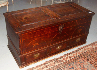 An Eighteenth Century blanket chest inlaid with the name "Barbara Schmittin†realized $1,553.