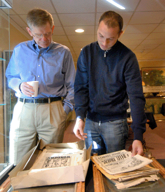 Brock Jobe, left, of Winterthur in Delaware, and Derin Bray of Northeast Auctions, Portsmouth, N.H., look over a lot of 1860‷0 circus broadsides collected by Brownell. The lot was estimated at $500/700, but went out at $4,025. 