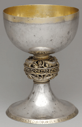 Made of silver and silver gilt, this elegant Northern European chalice dates to 1222 and has a Latin inscription around its base that identifies its maker and date of manufacture. The central section is decorated with six intertwined dragons. It is 7½ inches high. The Metropolitan Museum of Art, the Cloisters Collection.