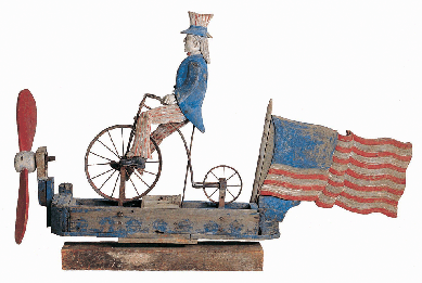 Uncle Sam Riding a Bicycle, whirligig, artist unidentified, probably New York State, circa 1880‱920, paint on wood with metal, 37 by 55½ by 11 inches. Collection American Folk Art Museum, gift of Dorothea and Leo Rabkin 2008. ⁊ohn Parnell photo