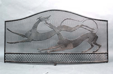 A fire screen attributed to Wilhelm Hunt Diederich, with mounted wire mesh depicting two playful hounds, circa 1920, soared to $34,500.