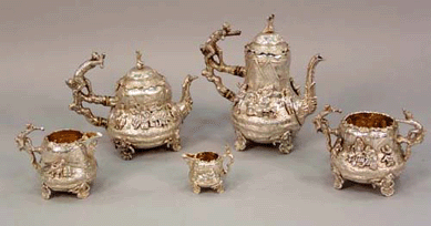An English Victorian silver five-piece tea set, bearing the hallmark of Charles Stuart Harvis, London, 1873, sold for $11,500.