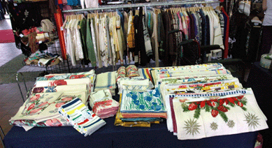 A table stocked with new old stock printed and striped kitchen towels, mostly from the 1950s, were going for $10․20 at Right to the Moon, Alice, New York City.