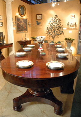 Much of Aileen Minor's eye-catching space was given over to this massive Boston mahogany extension table, circa 1825, a pedestal-based, accordion-action example that when fully extended would stretch to 151 inches long and accommodate up to 12 people. The Centreville, Md., dealer even had the original wooden storage box for the extension leaves.